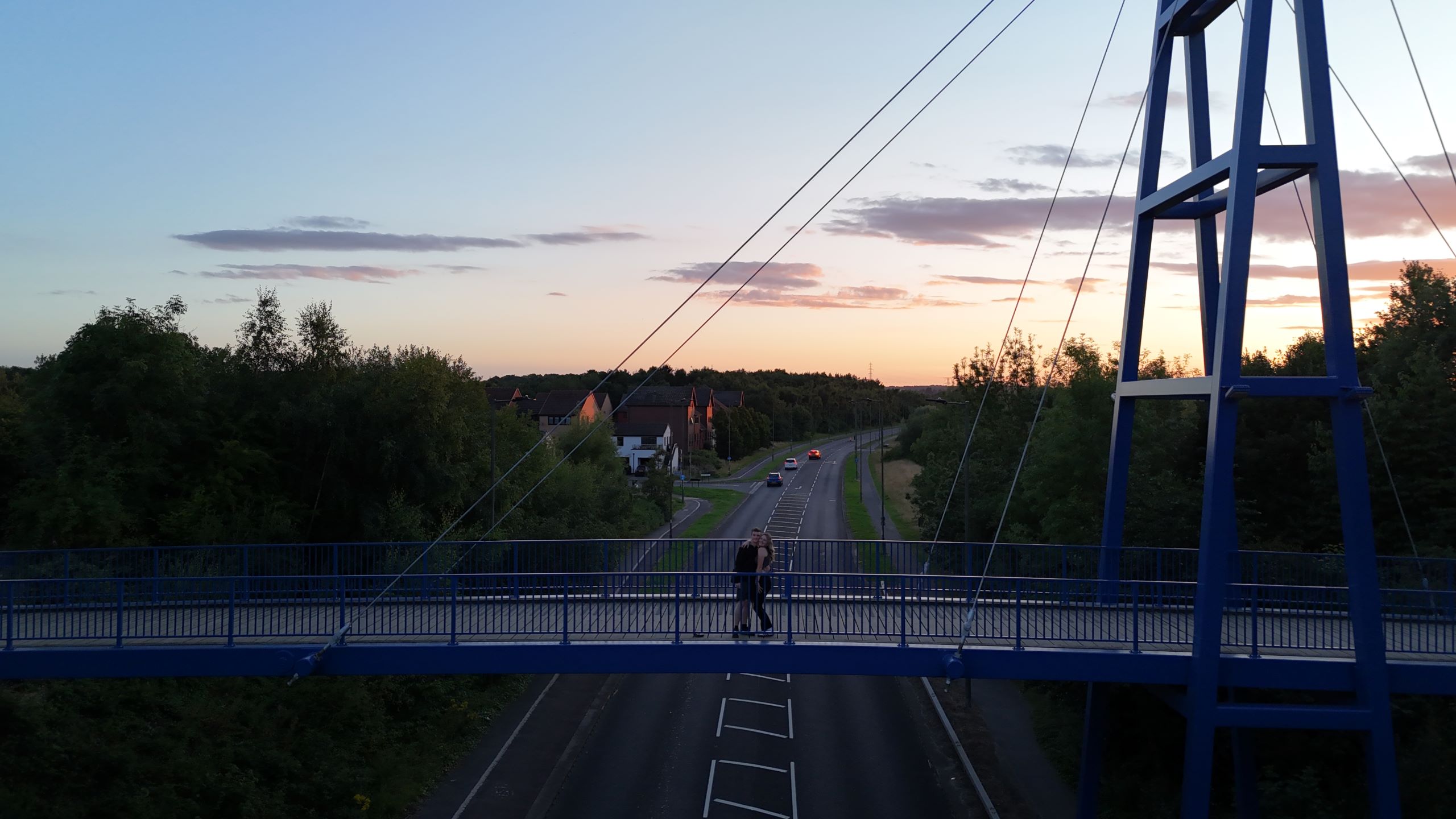 Picture of a bridge with 2 people on